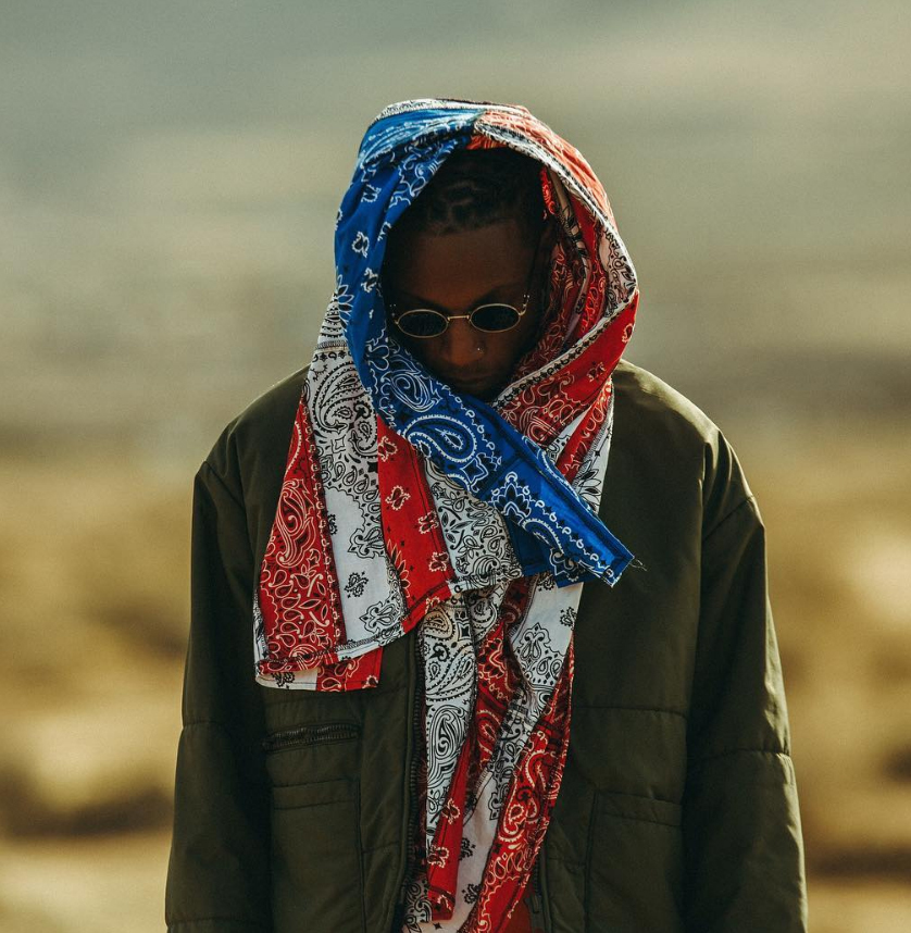 Joey Bada$$ with custom American flag wrapped around his head.